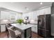 Contemporary kitchen features stainless steel appliances and an island with barstool seating at 1967 Cogar Dr, Decatur, GA 30032