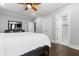 View of bedroom showing hardwood floors, doorway to bathroom, and view to the flat screen TV at 1967 Cogar Dr, Decatur, GA 30032