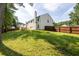 Exterior view of fenced backyard, deck, and home at 2720 Meridian Ct, Dacula, GA 30019