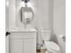 Half-bathroom features a stylish vanity, modern fixtures, and crisp decor at 2720 Meridian Ct, Dacula, GA 30019