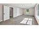 Bedroom with plush carpet, natural light from window, and white trim at 2720 Meridian Ct, Dacula, GA 30019