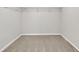 A small empty walk-in closet with neutral carpet at 2720 Meridian Ct, Dacula, GA 30019