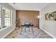 Stylish home office featuring modern decor, wood-look floors, and a focal wood slat wall at 2720 Meridian Ct, Dacula, GA 30019