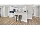 Open-concept kitchen features a breakfast bar, stainless steel appliances, and ample counter space at 2720 Meridian Ct, Dacula, GA 30019