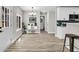 Well-lit kitchen flows into entryway with stainless steel appliances, and convenient breakfast bar at 2720 Meridian Ct, Dacula, GA 30019