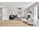 Inviting living room featuring a fireplace, light-colored wood floors, and comfortable seating arrangement at 2720 Meridian Ct, Dacula, GA 30019