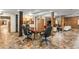 Spacious living room with exposed brick, tile floors, and a large table with chairs at 273 12Th Ne St # 210, Atlanta, GA 30309
