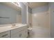 Bright bathroom features white cabinets, tiled floor, and a shower/tub combo at 2794 Craig Ct, Marietta, GA 30062