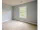 Serene bedroom featuring soft natural light from large windows, and neutral carpet at 2794 Craig Ct, Marietta, GA 30062