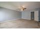 Bedroom with neutral carpet, light gray walls, and a ceiling fan at 2794 Craig Ct, Marietta, GA 30062
