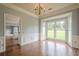 Elegant dining room with hardwood floors, wainscoting, and a chandelier, perfect for formal gatherings and entertaining at 2794 Craig Ct, Marietta, GA 30062
