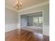 Formal dining room features hardwood floors, elegant chandelier, and classic wainscoting at 2794 Craig Ct, Marietta, GA 30062
