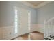 Bright foyer featuring wood floors, paneled walls, and a white door, offering a clean and inviting entry at 2794 Craig Ct, Marietta, GA 30062