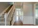 Inviting hallway with hardwood floors, elegant staircase, and classic wainscoting at 2794 Craig Ct, Marietta, GA 30062