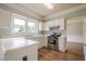 Charming kitchen features white cabinets, stainless steel appliances, and hardwood floors at 2794 Craig Ct, Marietta, GA 30062