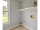 Laundry area with tile flooring and large window at 2794 Craig Ct, Marietta, GA 30062
