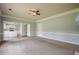 Comfortable living room featuring plush carpet and seamless access to kitchen at 2794 Craig Ct, Marietta, GA 30062
