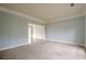 Bright living room with neutral tones, carpet and views into the dining room, creating a comfortable and inviting space at 2794 Craig Ct, Marietta, GA 30062