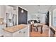 Bright kitchen featuring granite countertops, stainless steel appliances and open floor plan into the dinning and living room at 3586 Maple Hill Rd, Stonecrest, GA 30038