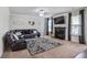 Comfortable living room with a fireplace, plush seating, and large windows at 3586 Maple Hill Rd, Stonecrest, GA 30038
