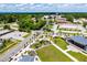 Aerial view of park area with playground, green spaces, landscaping and nearby buildings and roads at 6391 Katherine St, Douglasville, GA 30134