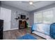 Bedroom with ceiling fan, wood-look flooring, and large windows for great natural lighting at 6391 Katherine St, Douglasville, GA 30134