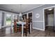 Bright dining room with a white table and access to other rooms at 6391 Katherine St, Douglasville, GA 30134