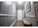 Neutral hallway with beadboard accents and a bench at 6391 Katherine St, Douglasville, GA 30134