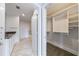 An open bathroom with white cabinets, granite countertops, tile flooring, and an attached closet at 2255 Peachtree Ne Rd # 620, Atlanta, GA 30309