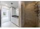 Beautiful bathroom featuring a tiled shower, granite countertop, and plenty of cabinet space at 2255 Peachtree Ne Rd # 620, Atlanta, GA 30309