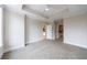 Bedroom featuring tray ceiling, ceiling fan, carpet floors and two entrances to the bathrooms at 2255 Peachtree Ne Rd # 620, Atlanta, GA 30309