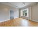 Bright bedroom with hardwood floors, large window, and neutral paint at 2255 Peachtree Ne Rd # 620, Atlanta, GA 30309