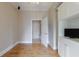 Empty bedroom with hardwood floors and white cabinets leading to a bathroom at 2255 Peachtree Ne Rd # 620, Atlanta, GA 30309