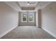 Bedroom featuring tray ceiling, ceiling fan, carpet floors and two windows at 2255 Peachtree Ne Rd # 620, Atlanta, GA 30309