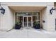 The building entrance features double glass doors, black flower boxes, and a secure access system at 2255 Peachtree Ne Rd # 620, Atlanta, GA 30309