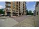 Exterior view of the building with balconies, street access, and nearby trees at 2255 Peachtree Ne Rd # 620, Atlanta, GA 30309