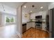Well-equipped kitchen with stainless steel appliances and bright breakfast bar extends to a living room view at 2255 Peachtree Ne Rd # 620, Atlanta, GA 30309