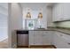 Charming kitchen with stainless steel dishwasher featuring breakfast bar and living room view at 2255 Peachtree Ne Rd # 620, Atlanta, GA 30309