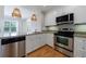 Bright and modern kitchen with stainless steel appliances and breakfast bar overlooking a tree lined community at 2255 Peachtree Ne Rd # 620, Atlanta, GA 30309