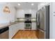 Modern kitchen showcasing stainless steel appliances, sleek white cabinets, and light stone countertops at 2255 Peachtree Ne Rd # 620, Atlanta, GA 30309