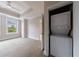 Bedroom with a window and a laundry area including a stacked washer and dryer at 2255 Peachtree Ne Rd # 620, Atlanta, GA 30309