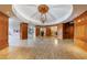 Luxury building lobby featuring a designer chandelier and beautiful wood accents at 2255 Peachtree Ne Rd # 620, Atlanta, GA 30309