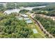 From above, the tennis courts, baseball field, playground and community pool appear in a wooded area at 3026 Towne Mill Ave, Canton, GA 30114
