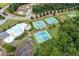 A community pool, tennis courts and baseball field are surrounded by mature trees at 3026 Towne Mill Ave, Canton, GA 30114