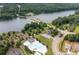 Aerial shot includes a community pool and lake surrounded by lush trees at 3026 Towne Mill Ave, Canton, GA 30114