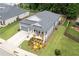 Charming single-story home featuring a well-manicured lawn, inviting front porch, and attached garage at 3026 Towne Mill Ave, Canton, GA 30114