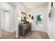 Inviting entryway with laminate floors, a console table, and a decorative mirror at 3026 Towne Mill Ave, Canton, GA 30114
