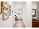 Hallway with wood-look flooring leading to a white door with light-filled views of the outside at 3026 Towne Mill Ave, Canton, GA 30114