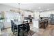 Open concept kitchen and dining area with stainless steel appliances and counter seating at 3026 Towne Mill Ave, Canton, GA 30114