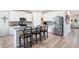 Bright kitchen with white cabinets, stainless steel appliances, and a center island with bar stool seating at 3026 Towne Mill Ave, Canton, GA 30114
